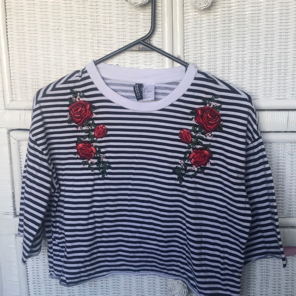 a loose, short sleeved, crop top.